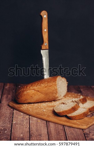 Knife in bread