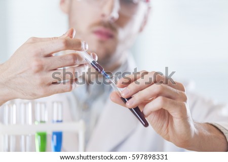 the doctor takes a sample out of the tube