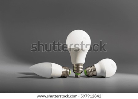 Electric light bulb on a gray background.