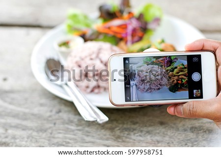 Take photo food by mobile phone.