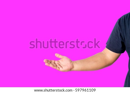 A man with casual wear show with a hand isolated over pink background with copy space for add word text title or logo. 
