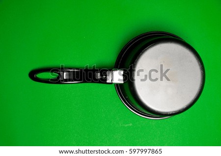 old cooking equipment Kitchenware pot pan on green screen background
