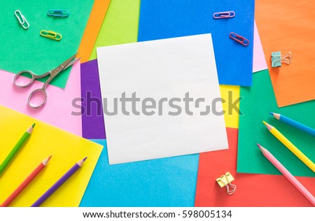 blank white paper on colorful paper background Royalty-Free Stock Photo #598005134