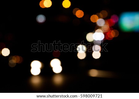 Road light bokeh. City life in night in abstract background. Night car driving concept