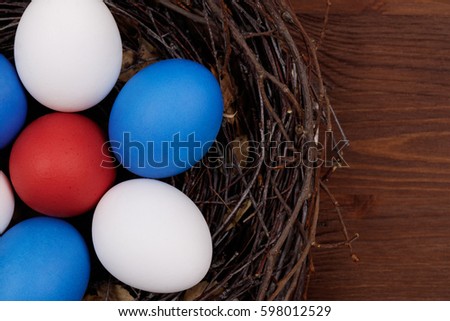 Nest with eggs on a wooden table