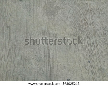 straight lines of concrete floor those were made for add more friction for vehicles can brake themselves more efficiently