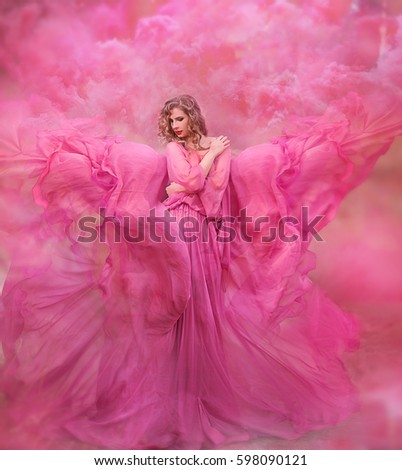 Glamorous photo. Girl in pink air dress.