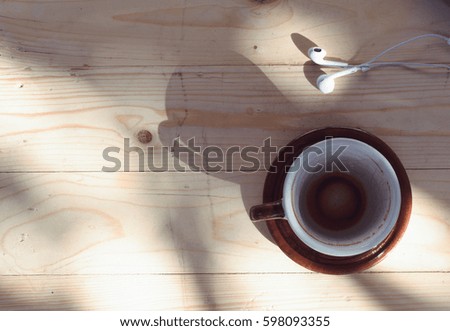 coffee cup and earphone  put on background