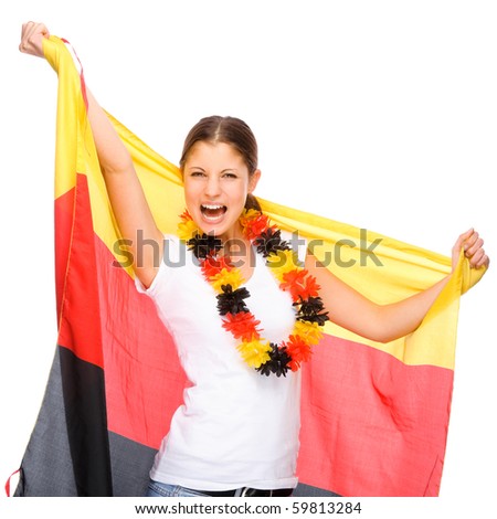 Full isolated studio picture from a young and beautiful woman with football and Germany flag