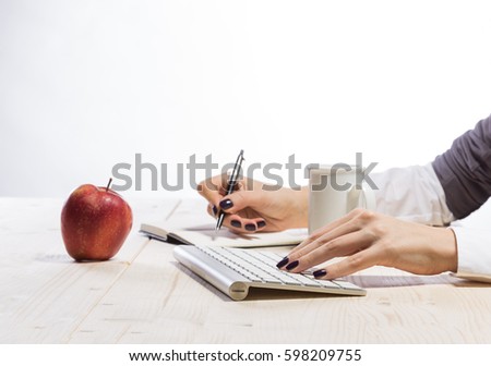 Business woman in an office holding red apple - Clipping Path