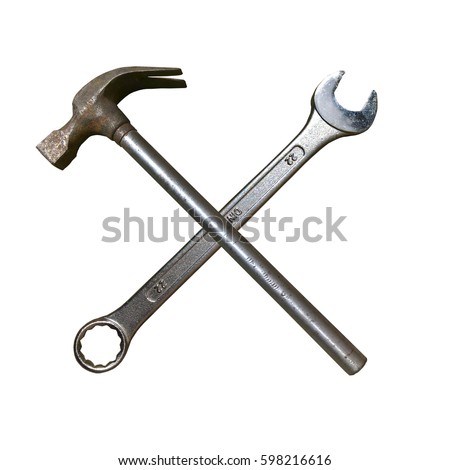 Metal Hammer and Spanner. Isolated cross made of spanner key and hammer. Royalty-Free Stock Photo #598216616