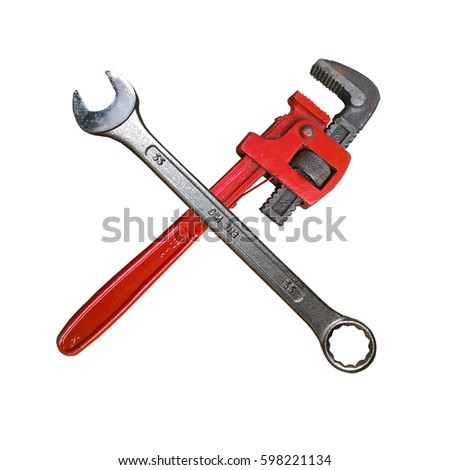 Wrenches Crossed. Isolated cross arranged of spanner and monkey wrench. White background. Royalty-Free Stock Photo #598221134