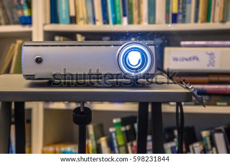 Portable beamer projector used on an office during presentation of bussines results