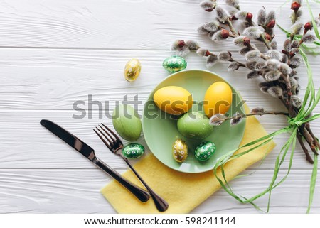 Easter concept. plate, fork, eggs on a white background Royalty-Free Stock Photo #598241144