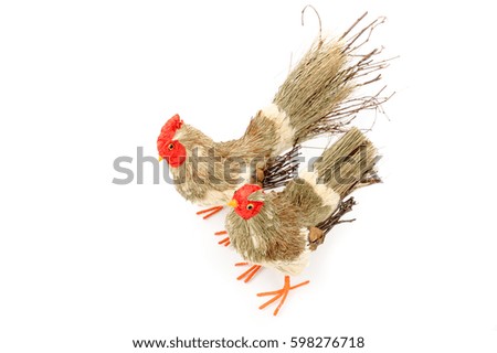 Decorative rooster and hen prepared from natural materials. Easter decoration. Interior, garden decor. Rooster prepared from branches and straws. Isolated on white background. Top, side view.