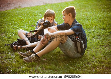 Two teenagers in a park on the grass