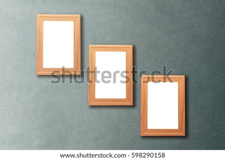 Group of blank wood picture frame on the old vintage wall with copy space for moc up your product display 