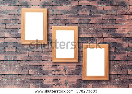 Group of blank wood picture frame on the old brick wall with copy space for moc up your product display 