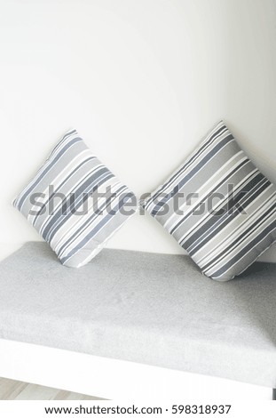 Beautiful pillow on sofa decoration in living room interior