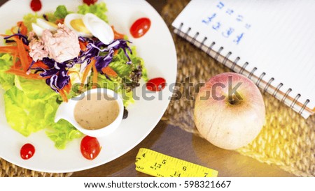 close up of diet plan paper and salad,healthy lunch and diet concept