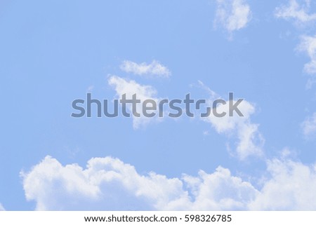 White fluffy clouds in  blue sky and space