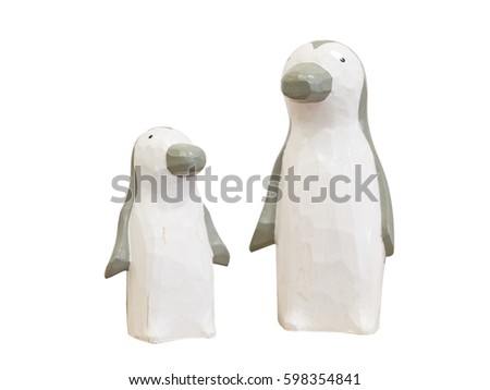 Penguin wooden dolls isolated on white background. Clipping paths included