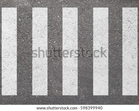 crosswalk on the road for safety when people walking cross the street. Royalty-Free Stock Photo #598399940