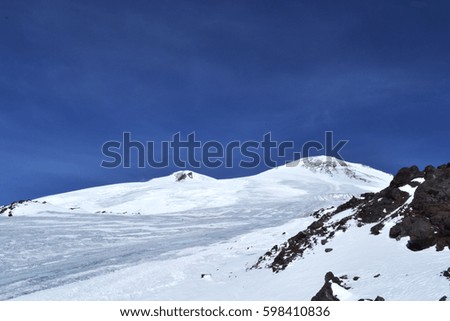 beautiful winter mountains with blue sky, snowy peaks. amazing scenic nature landscape. photo on the theme of mountains, nature, adventures, travel. 