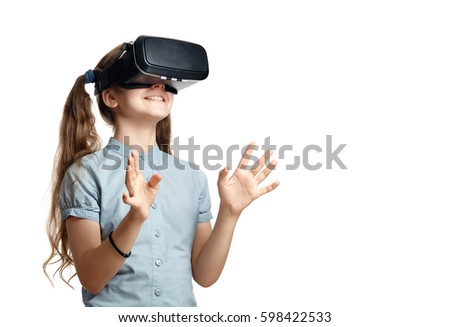 Young girl with virtual reality glasses.  Isolated on white background.  VR headset. Royalty-Free Stock Photo #598422533
