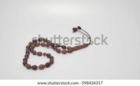Wooden rosary or Tasbih on with background. Selective focus