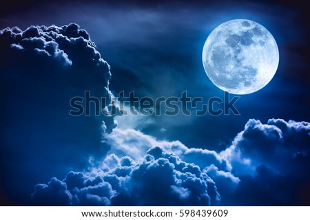Super moon. Attractive photo of background night sky with cloudy and bright full moon. Nightly sky with beautiful full moon. The moon were NOT furnished by NASA. Royalty-Free Stock Photo #598439609