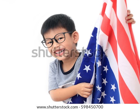 Cute toddler boy holding american flag. Independence Day concept on white background.copy space.Boy and big American flag, on white background.