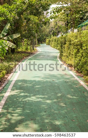 Green bicycle lane in public park, sport healthy and exercise.