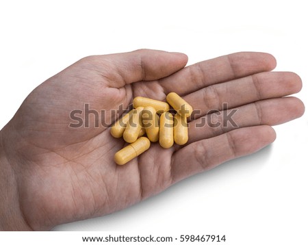 Pills capsules isolate on hand white background, Slim pill Harm to the Health, Weight loss pills