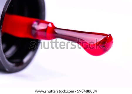 fashion red nail polish bottle and nail brush on white background.