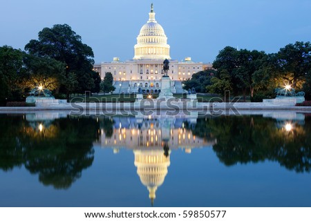 The United States Capitol building in Washington DC, USA - after dark with water reflection Royalty-Free Stock Photo #59850577