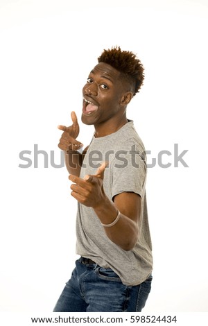 young friendly and happy afro american man smiling excited and posing cool and cheerful isolated on white background having fun looking positive in intense happiness facial expression 