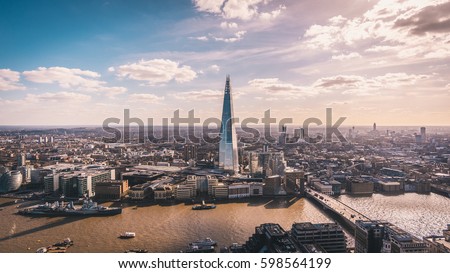 Stunning panorama view over Thames river, the Shard, the London skyline and cityscape from the skyscraper. Aerial photo over the big city.