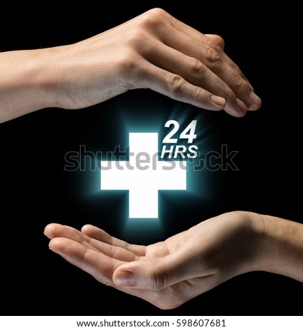 Isolated image of two hands on black background. Round-the-clock medical care icon in the center. Concept of Round-the-clock medical care.