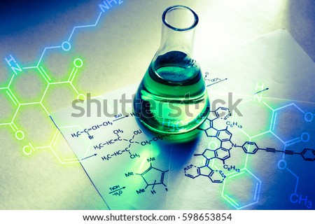 Chemical tube with reaction formula in light Royalty-Free Stock Photo #598653854