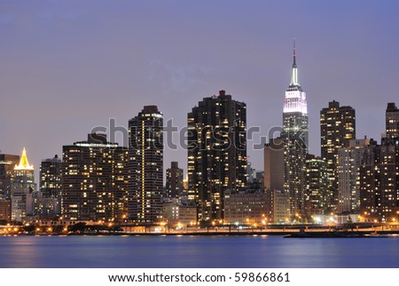Cityscape of Midtown Manhattan across the Hudson River at night.
