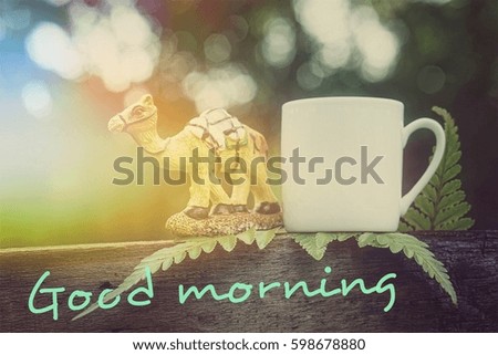 Good morning concept: having fun while enjoying a hot cup of coffee and camel outdoors