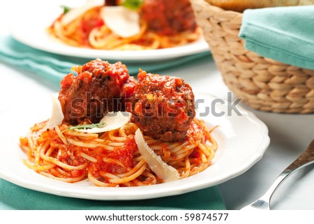 spaghetti with tomato sauce and large meatballs