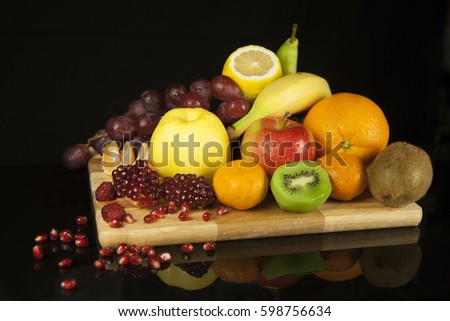 Different fruits on a black background