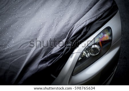 Wet car cover  Royalty-Free Stock Photo #598765634
