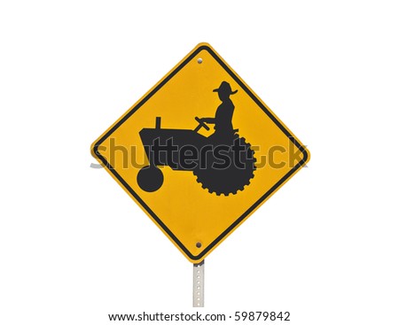 Farm tractor crossing caution sign isolated on white.