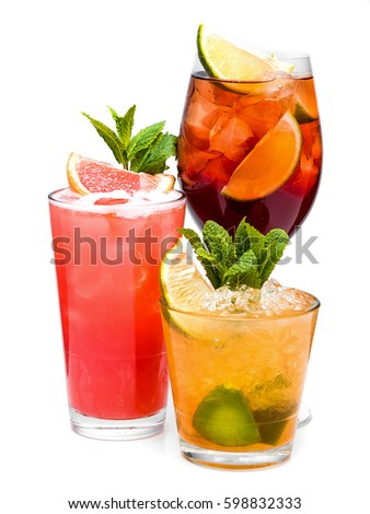 Three different alcoholic cocktails on a white background