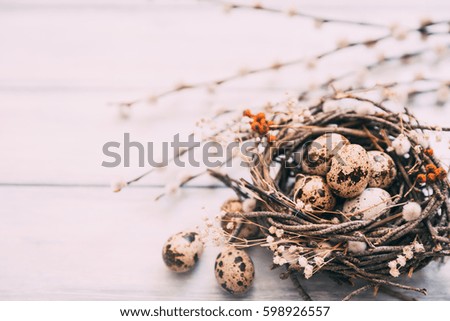 Happy easter background. Nest with eggs over wooden background 