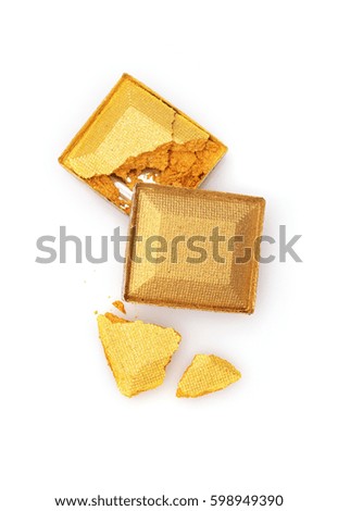 Golden crashed eyeshadow for make up as sample of cosmetic product isolated on white background