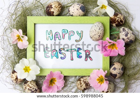 Happy Easter note in a frame with quail eggs in a nest